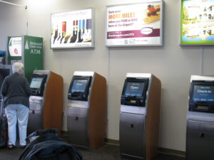 Image of Alaska Airlines check-in kiosks inside the STS terminal