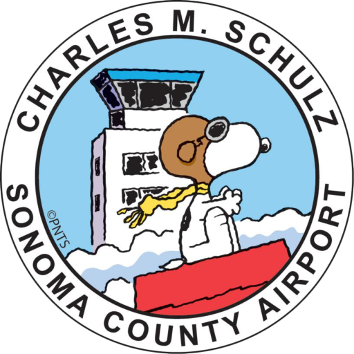 STS logo featuring Snoopy as the Red Baron flying by the STS Airport tower.
